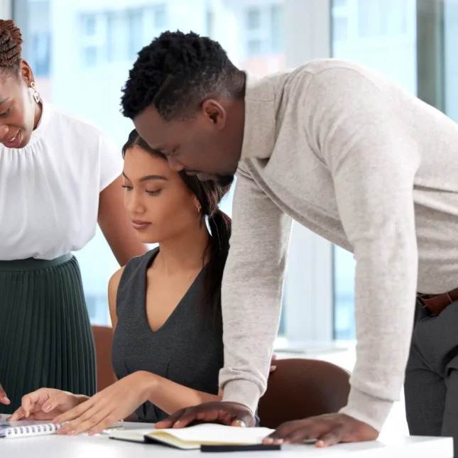 running-through-final-draft-together-shot-group-businesspeople-going-through-paperwork-together-office